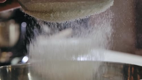 Close-Up Flour Sifting with Sieve for Bread and Pastry Making. Conception Cooking