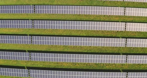Aerial shot of photovoltaic sun panels used for renewable clean energy in a sunny day.