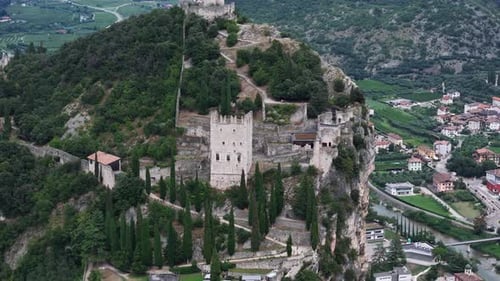 Camera panning around medieval castle ruins on mountain top