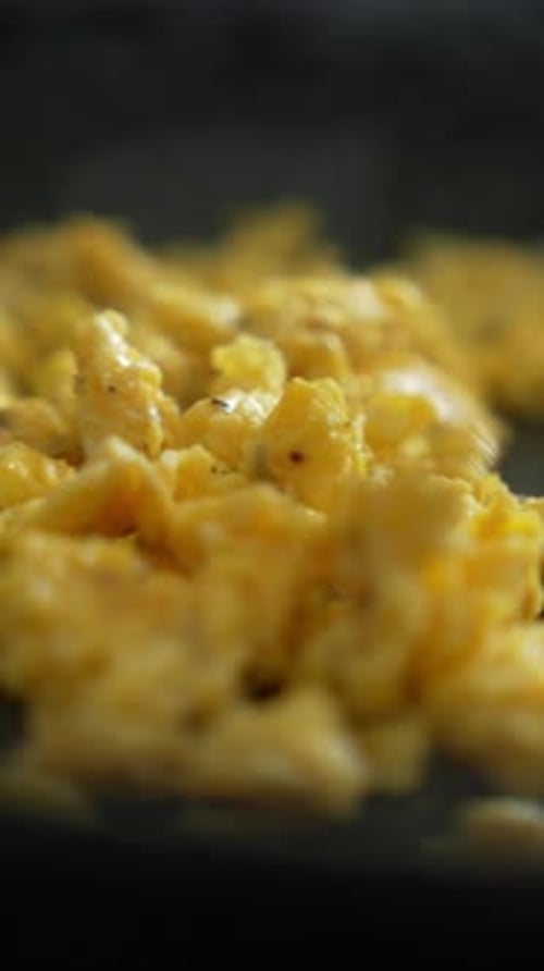 Cooking scrambled eggs, omelette. Preparation breakfast food on pan