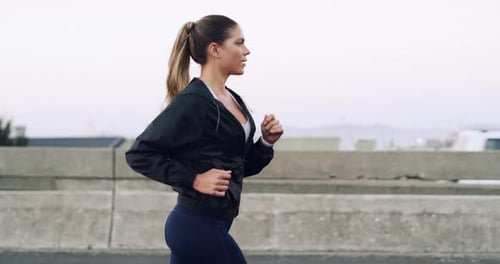 Young Woman Running in Urban Area