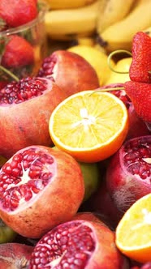 Colorful Display of Fresh Fruits at a Market Stall