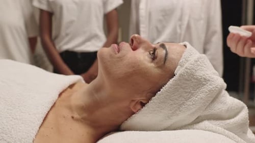 Woman Receiving Facial Treatment at Indoor Spa