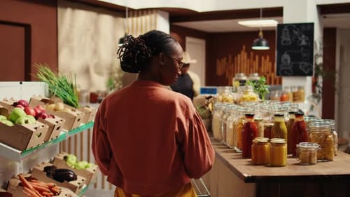 Woman Shops at Organic Grocer for Local Food