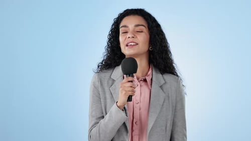 Smile, microphone and news with a woman anchor on blue background in studio for an interview