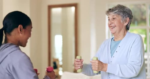 Women Exercising with Dumbbells at Home