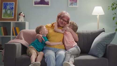 Grandmother Receiving Loving Hugs from Grandchildren at Home