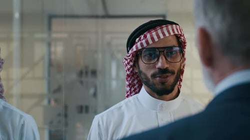 Businessmen Talking in Office Building, Close Up