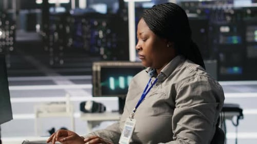 Woman Reacts to System Hack in Modern Office