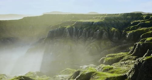 Misty Mountains and Lush Green Cliffs During Early Morning Light
