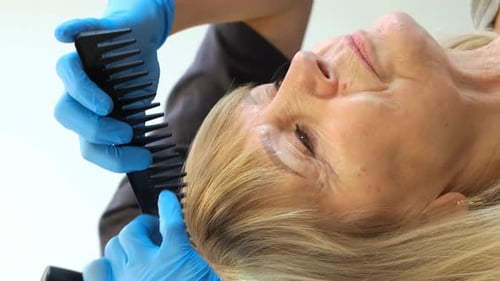 Senior Woman Gets Hair Done at Salon