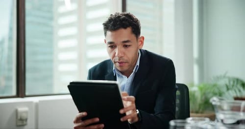 Businessman, tablet and reading in office for communication, news article or information in company