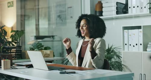 Happy, business woman and winning with laptop at office for good news, promotion or online bonus