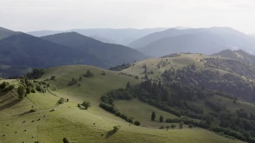 Dappled Light Over Carpathian Mountain Pastures and Woodlands