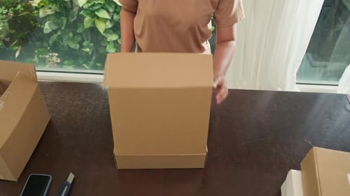 Woman Unboxing Stylish Platform Sandals at Home