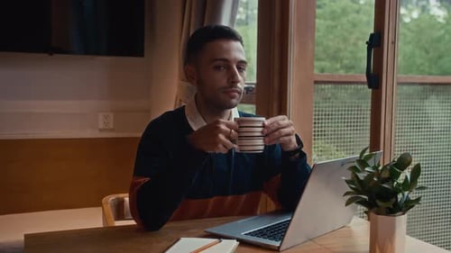Portrait of Freelancer Working on Laptop at Home Office