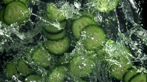 Sliced Cucumbers Fall Into the Water Filmed on a Highspeed Camera at 1000 Fps