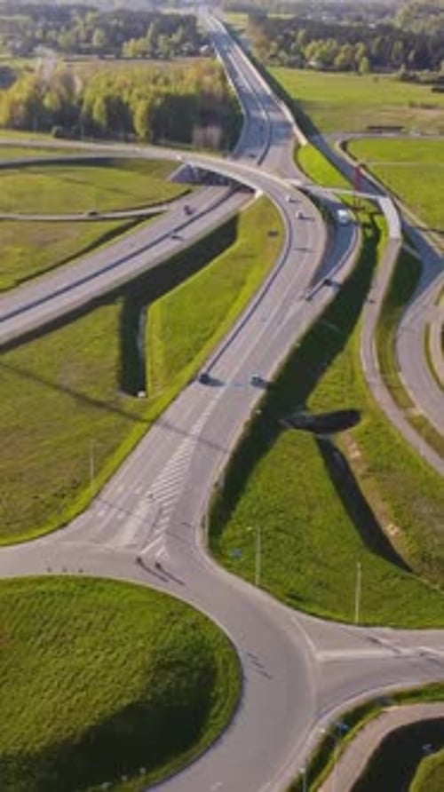 Vertical slow drone pull away over Katlakalns junction connecting A5 Riga bypass with Daugmale road