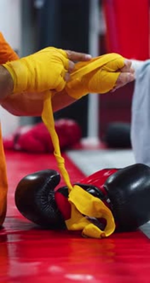 Boxer Wrapping Hands in Gym Getting Ready