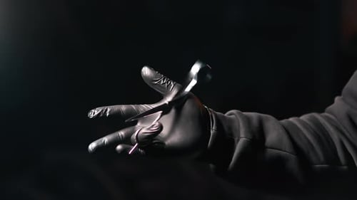 Barbershop Man Professional Barber Glove Playing Hairdresser Scissors Closeup Isolated on Black