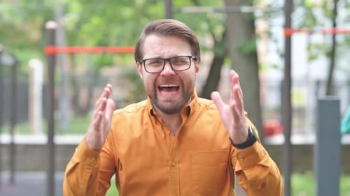 Portrait of Young Man Screaming and Shouting in Anger