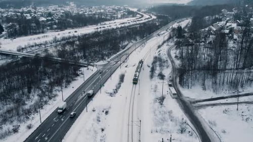 Aerial View of Snow-Covered Train on Winter Railway