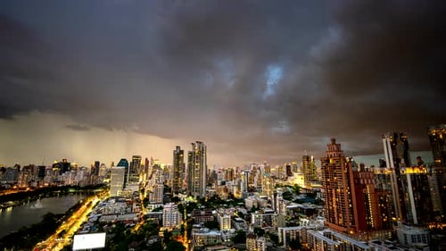 Spectacular cityscape of Bangkok town with dramatic stormy cumulus clouds, Thailand. Timelapse