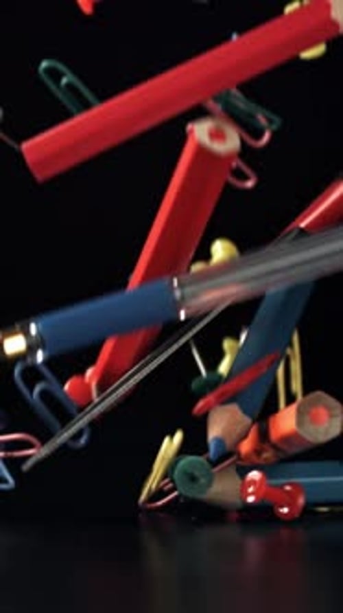 Various School Tools Fall on the Table Filmed on a Highspeed Camera at 1000 Fps