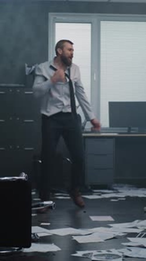 Aggressive Businessman in Fit of Rage Yells and Destroys Office Room