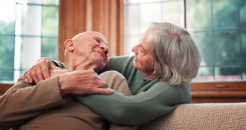 Affectionate Senior Couple Embracing at Home
