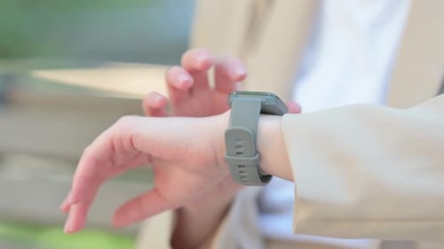 Close up of Female Hand Using Smartwatch Outdoor