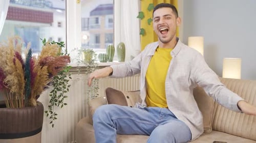 Happy man dancing to the camera.