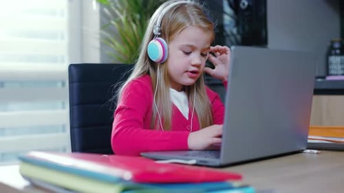 Close Up Child Girl Use Headphones Chatting Studing at Home During the Coronavirus Epidemic Distance