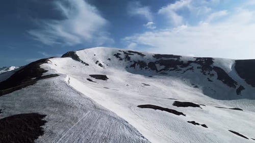Snowy Mountains Aerial View with Solitary Figure