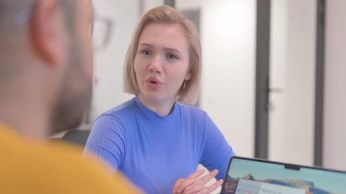 Close up of Blonde Woman Talking with Creative Teammate