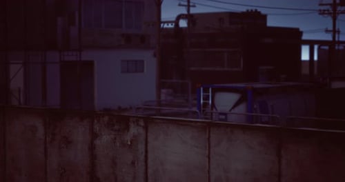 Urban Evening View with Buildings and Industrial Elements at Dusk