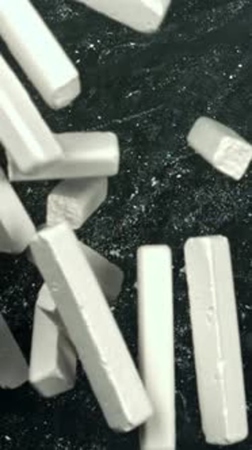 Chalk Falls on the Blackboard Filmed on a Highspeed Camera at 1000 Fps