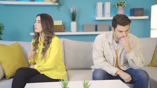 Unhappy married couple not talking to each other at home, in the process of divorce and separation.