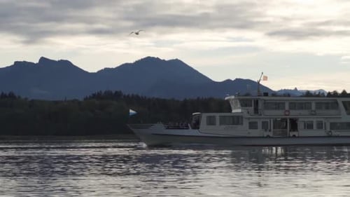Ferryboat passing by in front of Scenic Mountains - Segulls chasing the boat for food