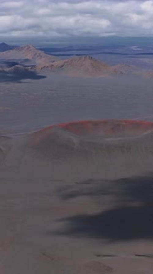 Aerial View of Red Rimmed Volcanic Crater in Iceland's Barren Landscape