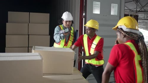 Blue collar workers working at warehouse.