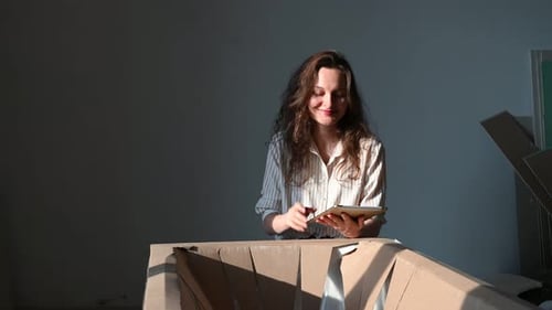 Woman Using Tablet Inside Home