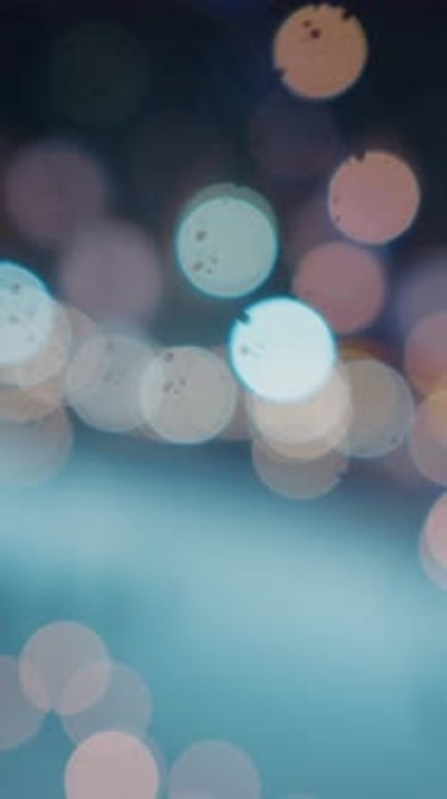 Defocused background in the park with ice rink decorated for Christmas.
