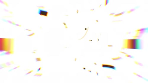 Falling Gold Confetti with soft focus rainbow color rays of light.