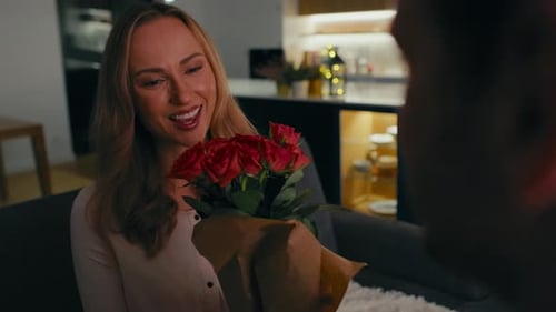Woman Receives Bouquet of Roses with Affection