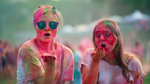 Women Celebrate Holi Festival with Colorful Powder