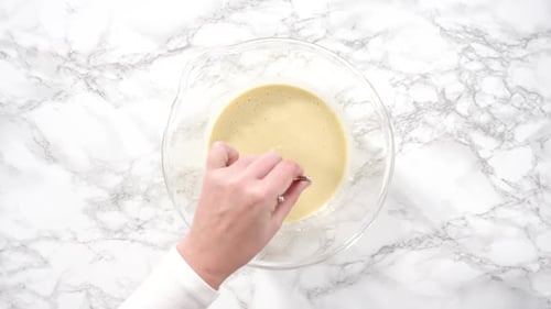 Electric Mixer Blends Food Batter in Bowl