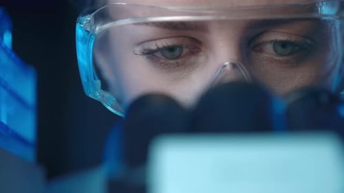 Woman Working in Lab wearing Safety Glasses
