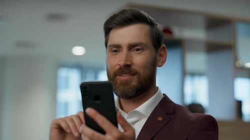 Euphoric ceo triumphing at office building expressing excitement and celebrating victory