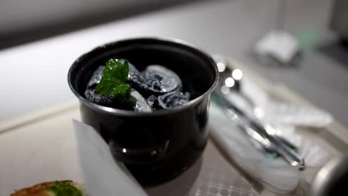 Serving and Decorating Tasty Meal with Mussels and Creamy Sauce in Restaurant with Seafood